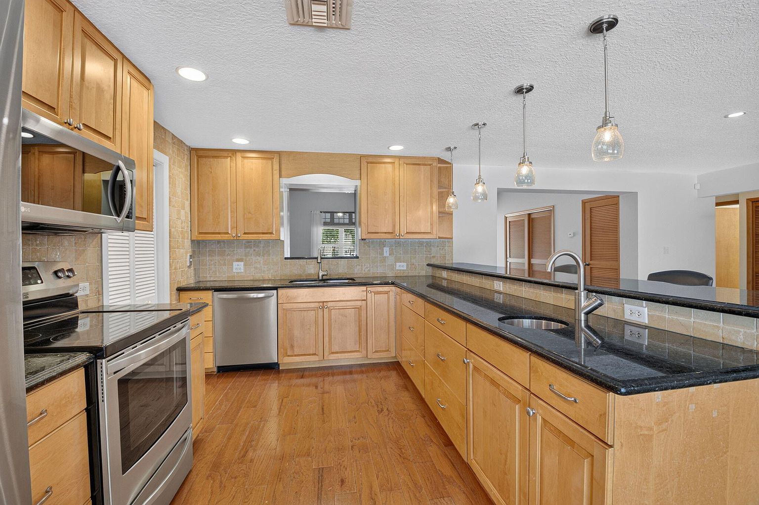 Kitchen with granite counters and stainless appliances, 1170 SW 21st Street, Boca Raton FL