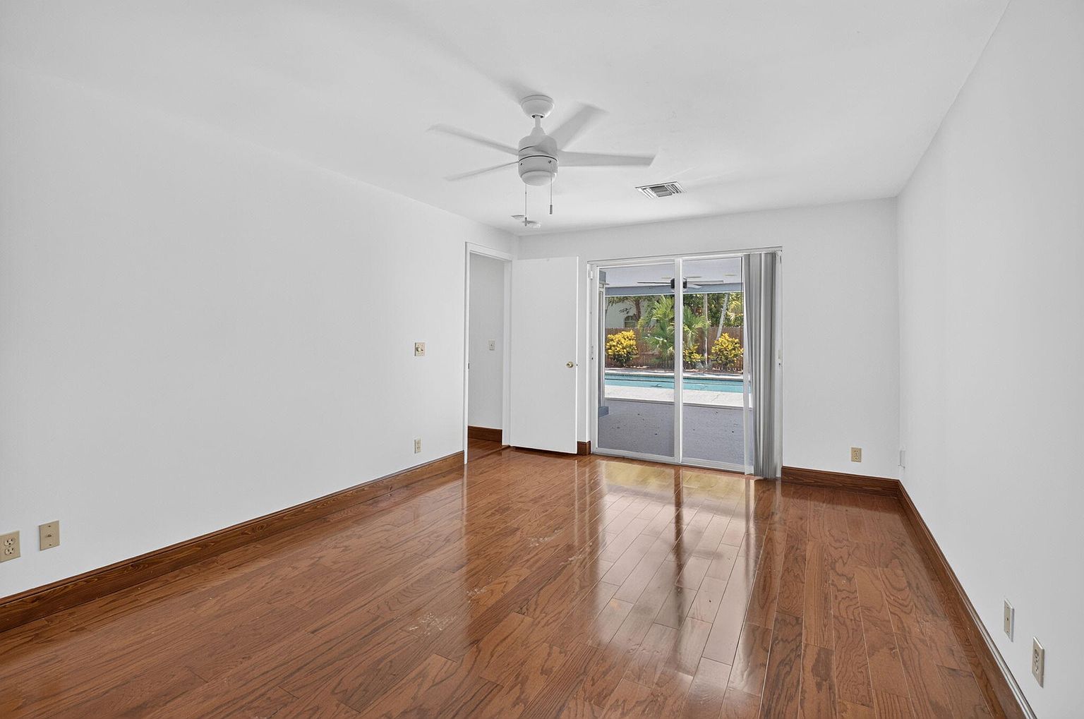Bedroom with wood floors and garden view, 1170 SW 21st Street, Boca Raton FL